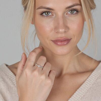 "Forever in Bloom" Round Cut Side Stone Engagement Ring