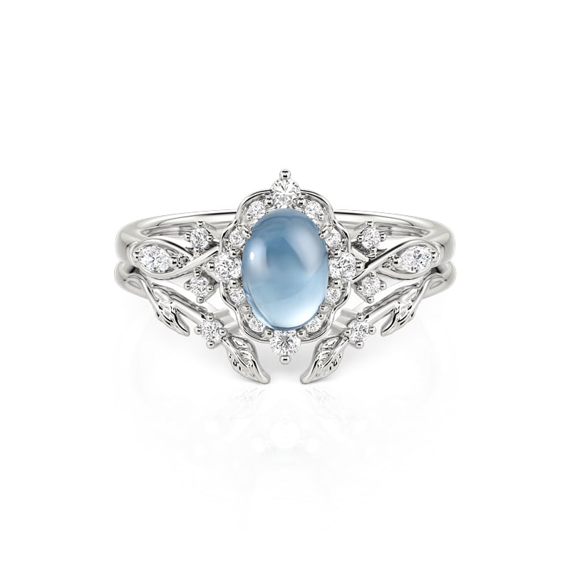 Jeulia Juego de Anillos Nupciales Halo de Hoja Vintage con Topacio Azul Ovalado