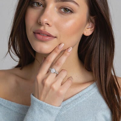 "A Moment Like This" Oval Cut Side Stone Engagement Ring