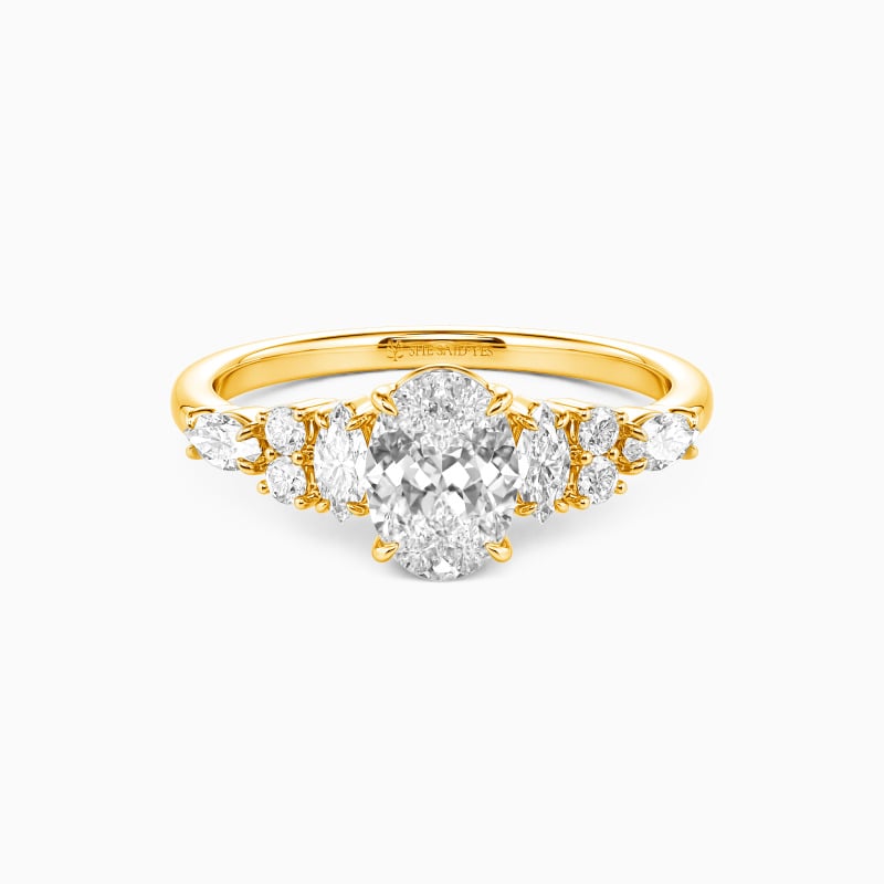 "The Beautiful Becoming" Oval Cut Cluster Side Stone Engagement Ring