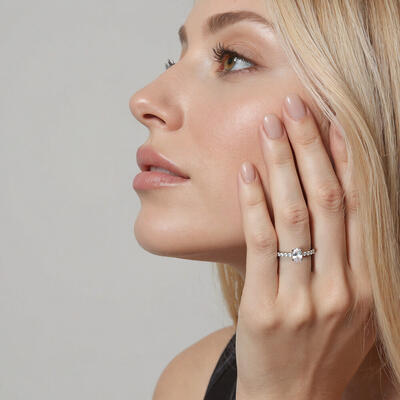 "Ever Since I Met You" Oval Cut Side Stone Engagement Ring
