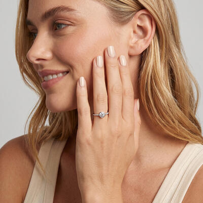"Holding Your Heart" Round Cut Side Stone Engagement Ring