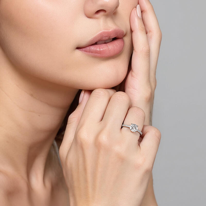 "Love is Light" 1ct Round Cut Side Stone Engagement Ring