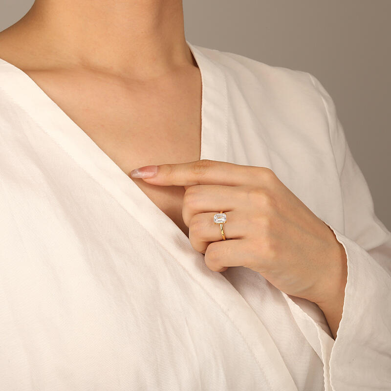 "Captivating Serenity" Emerald Cut Side Stone Engagement Ring