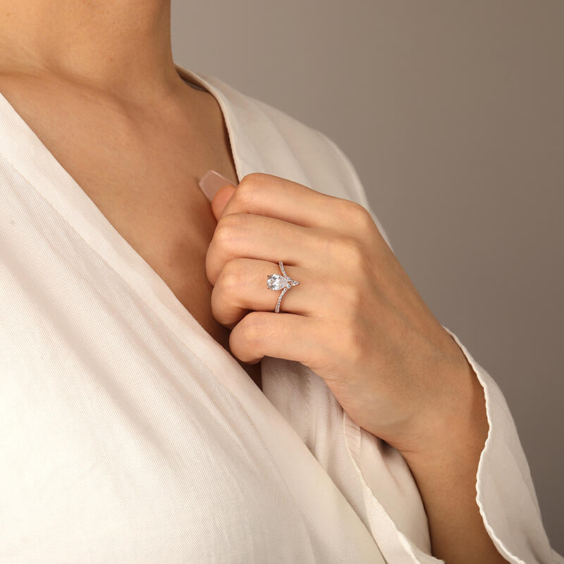 "A Drop Of Memories" Pear Cut Side Stone Engagement Ring