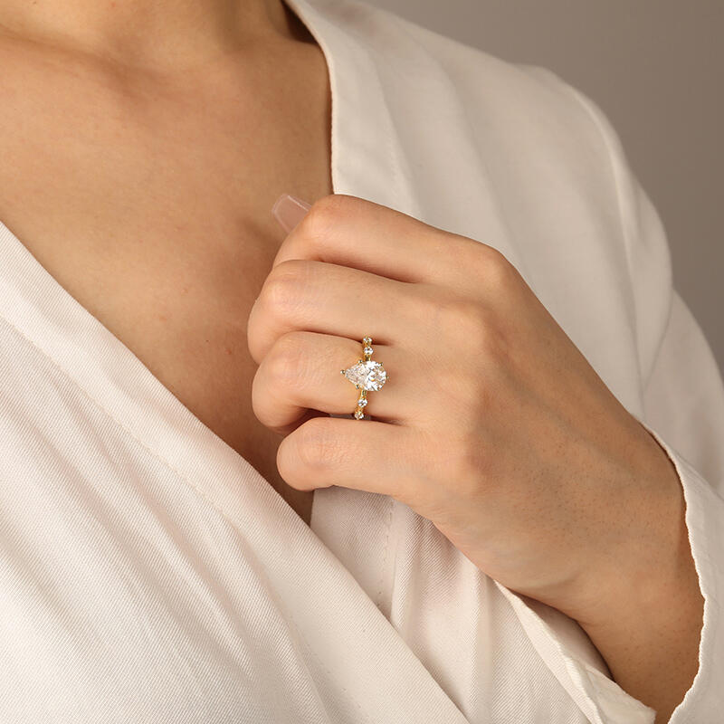 "Satellite Of Love" Pear Cut Side Stone Engagement Ring