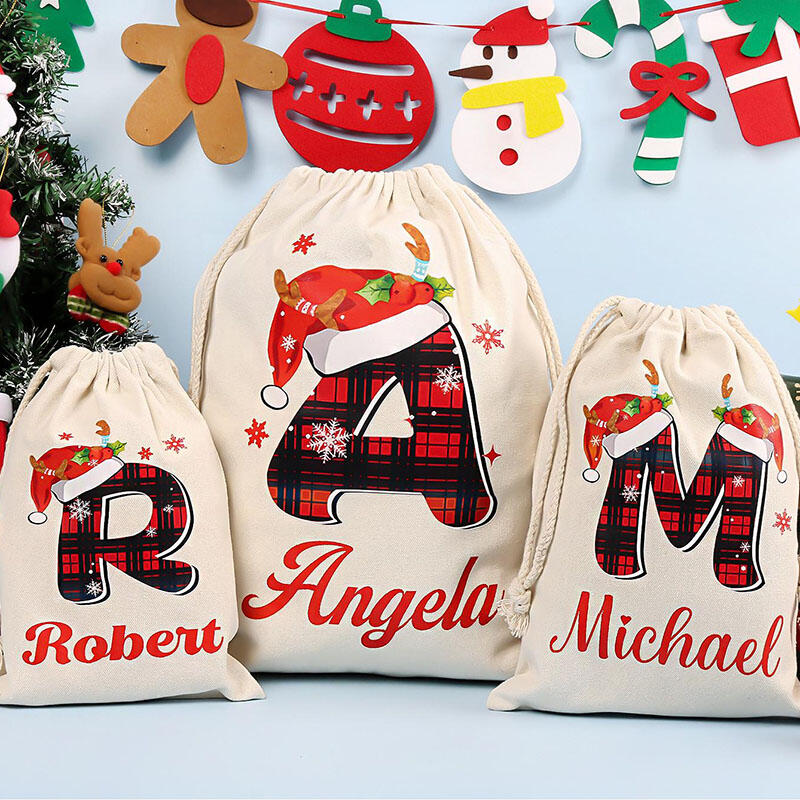 Julklappspåse med personligt namn och valfri bokstav Speciell present till familjen
