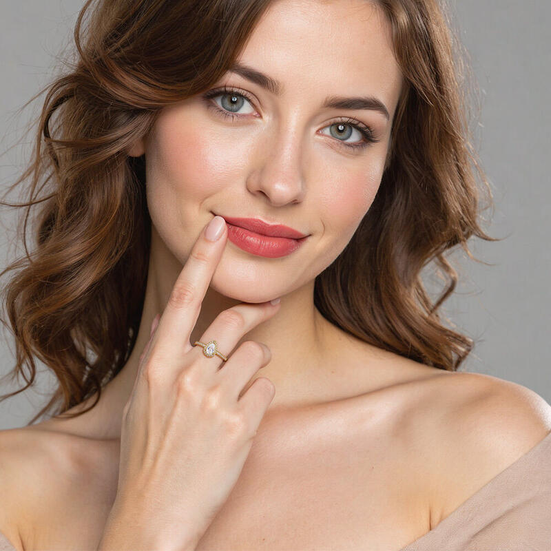 "Wange an Wange" Halo Verlobungsring 0,5 ct Birnenschliff