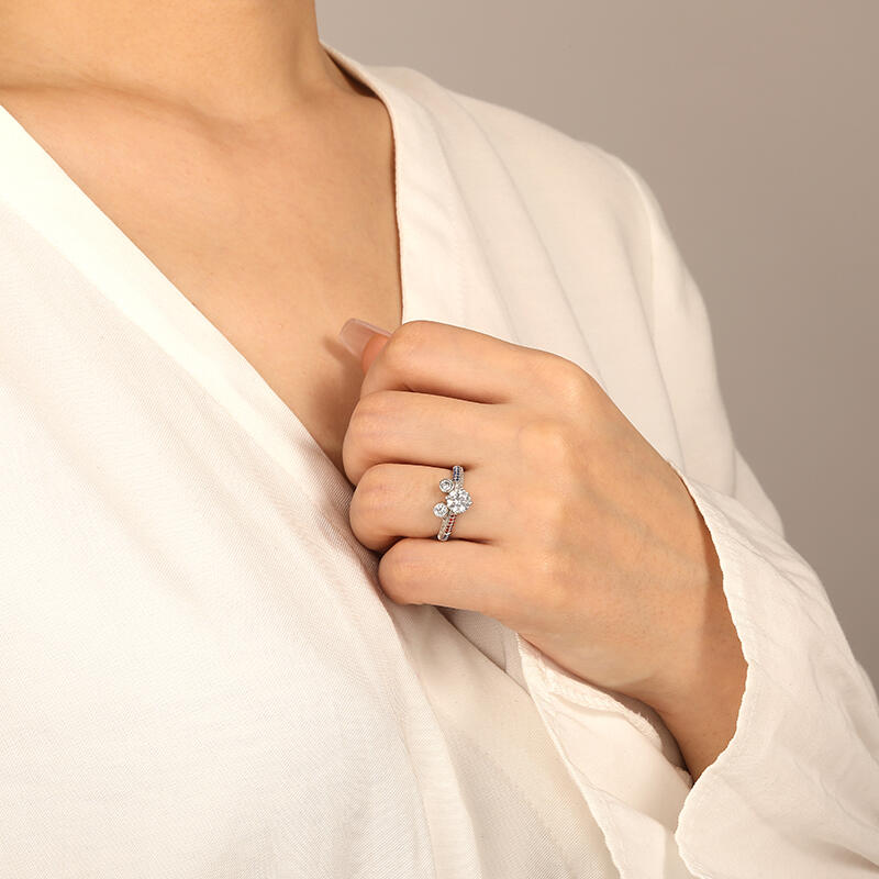 "Genuine Passion" Round Cut Side Stone Engagement Ring