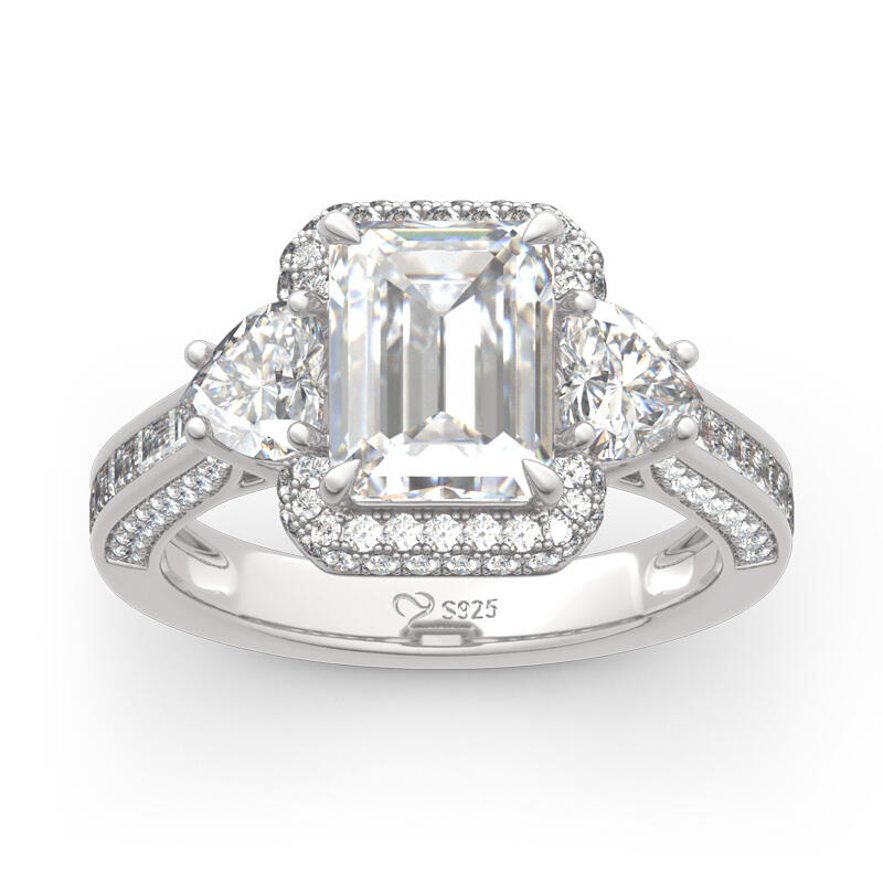 Jeulia Anillo de plata de ley de corte esmeralda con tres piedras de halo