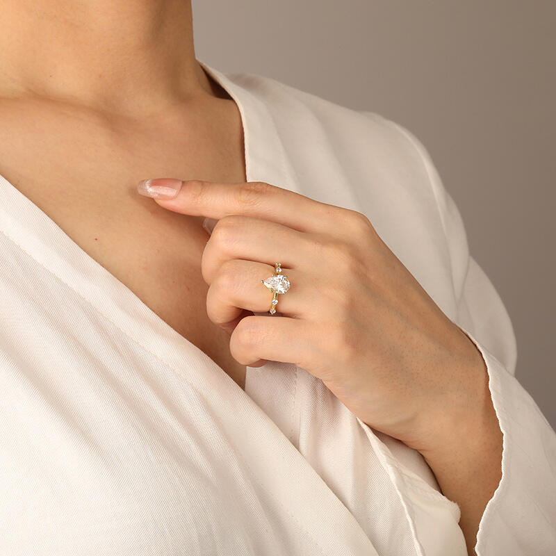 "Satellite Of Love" Pear Cut Side Stone Engagement Ring