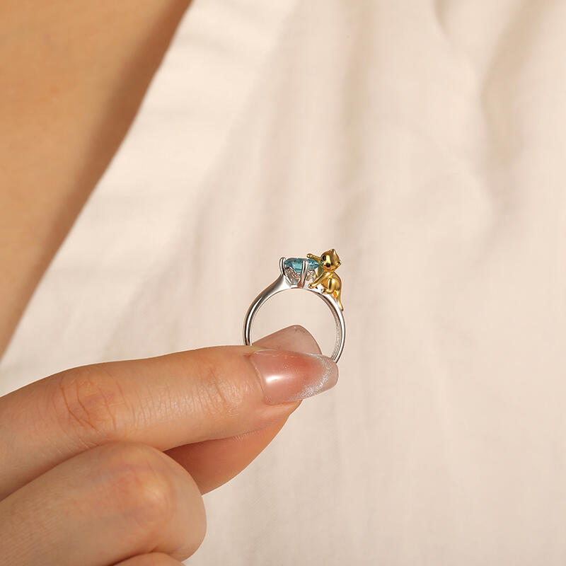 "My Furry Friend" Round Cut Side Stone Engagement Ring