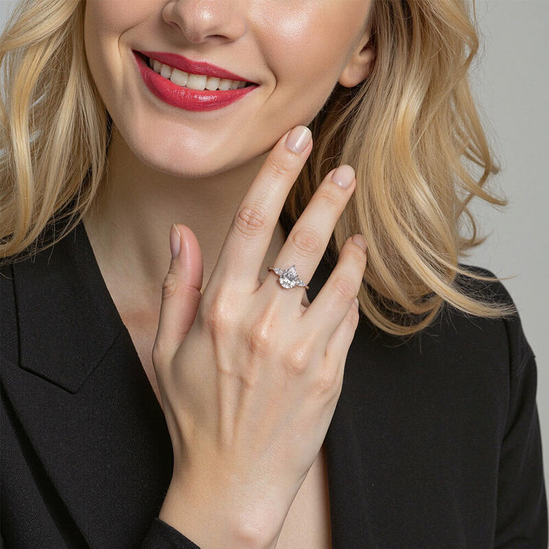 "Never-ending Story" Pear Cut Three Stone Engagement Ring