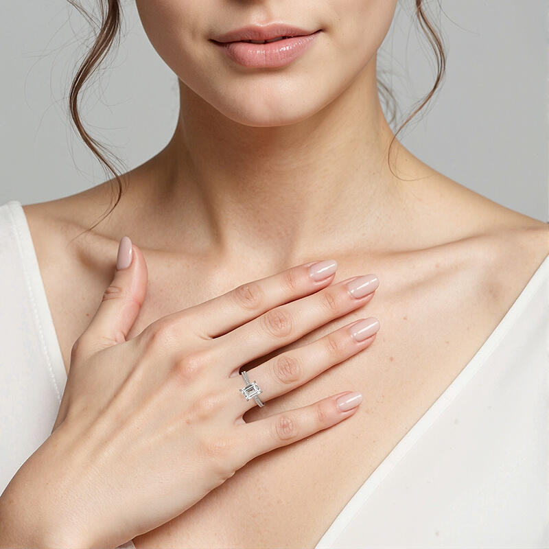 "Your Hand in Mine" 2ct Emerald Cut Side Stone Engagement Ring