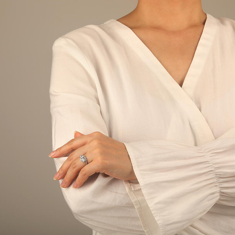 "Embracing Heart" Round Cut Side Stone Engagement Ring