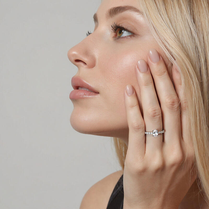 "Ever Since I Met You" Oval Cut Side Stone Engagement Ring