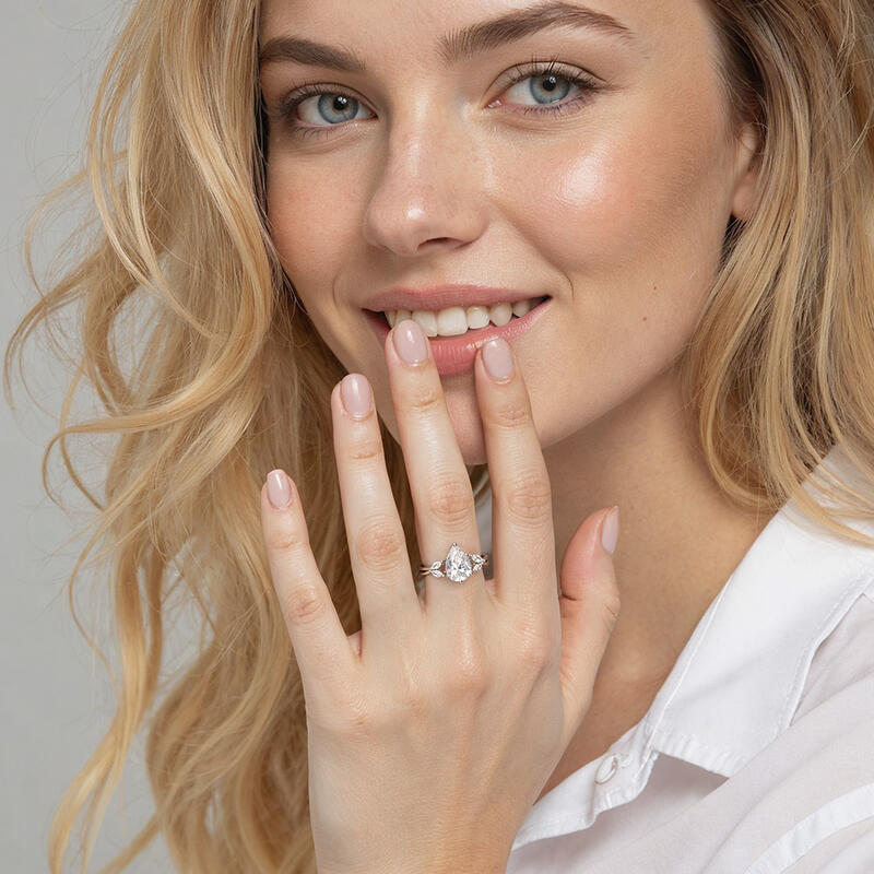"Sun Glint" 2ct Pear Cut Side Stone Engagement Ring