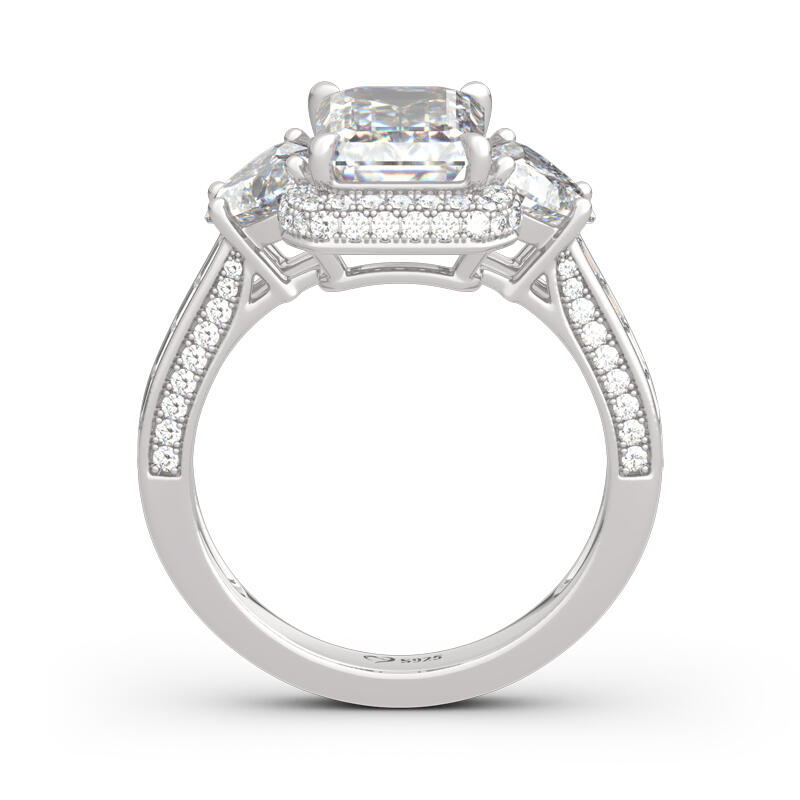 Jeulia Anillo de plata de ley de corte esmeralda con tres piedras de halo