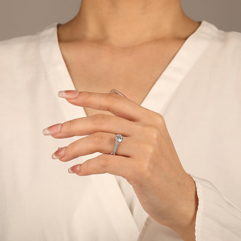 "The Breath From My Angel" Round Cut Side Stone Engagement Ring