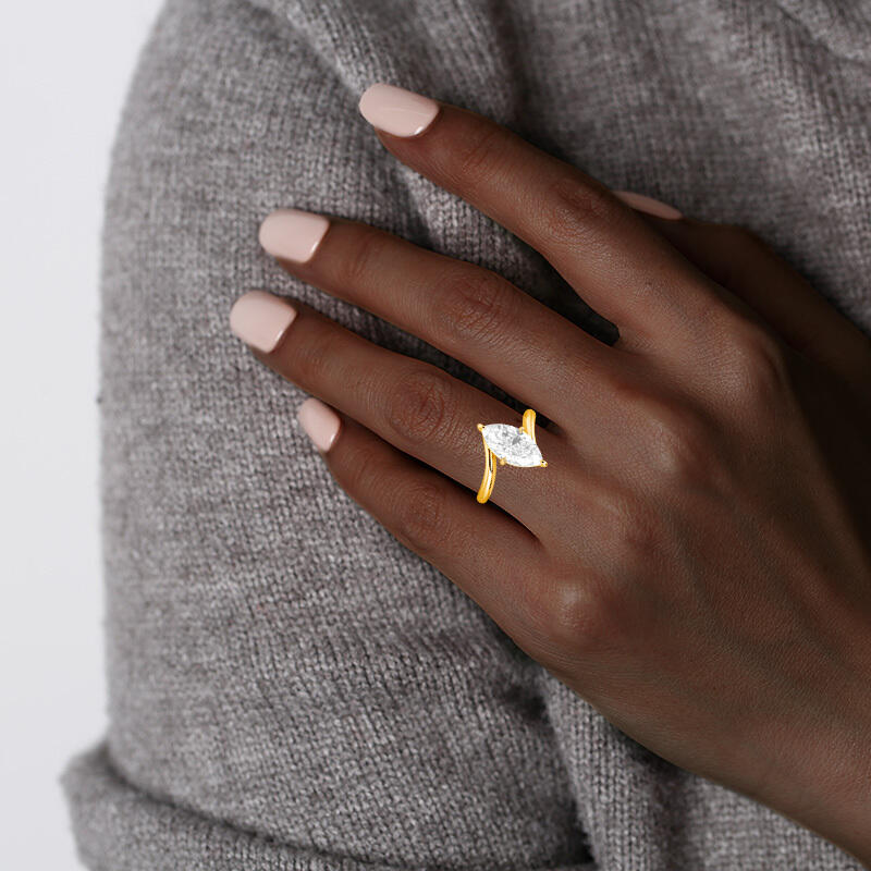 "Symphony in Motion" Marquise Cut Solitaire Engagement Ring