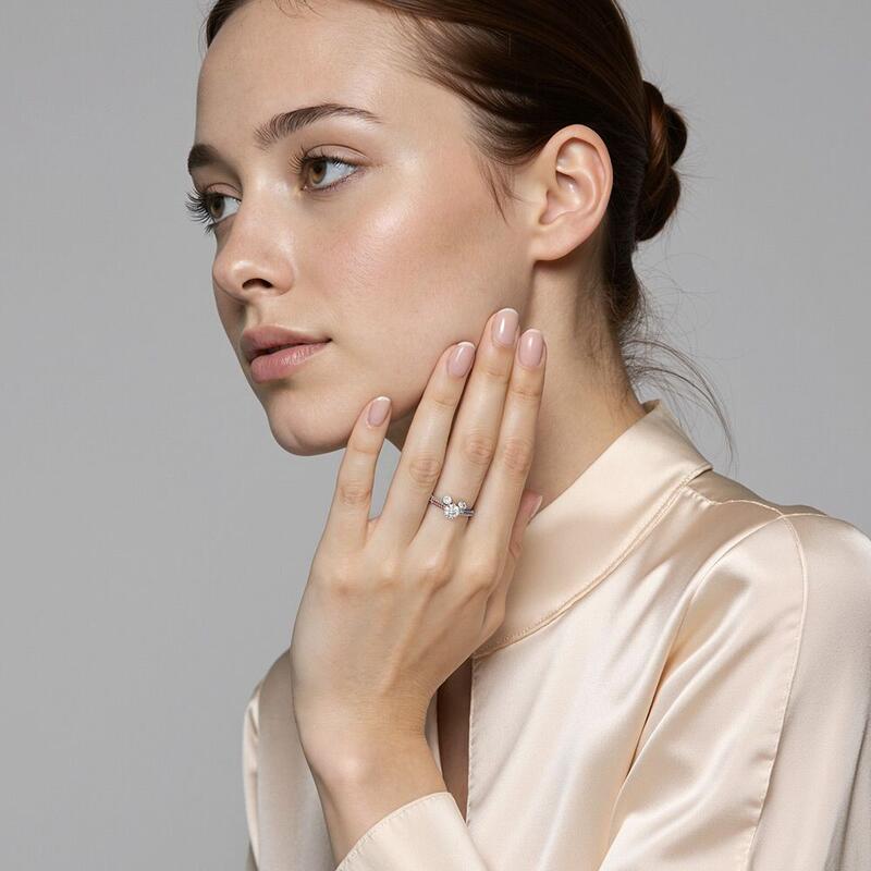 "Genuine Passion" Round Cut Side Stone Engagement Ring