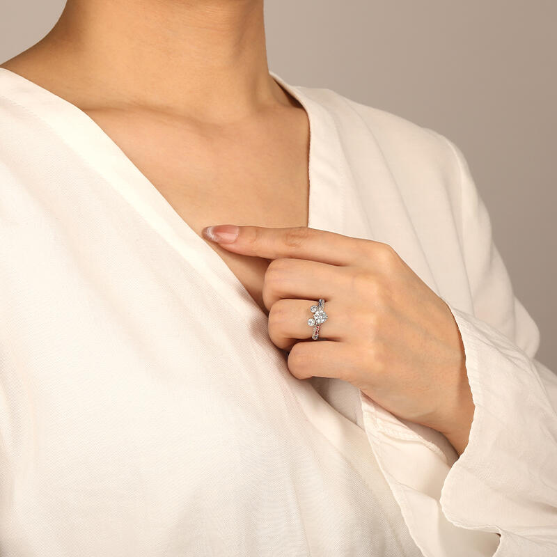 "Genuine Passion" Round Cut Side Stone Engagement Ring