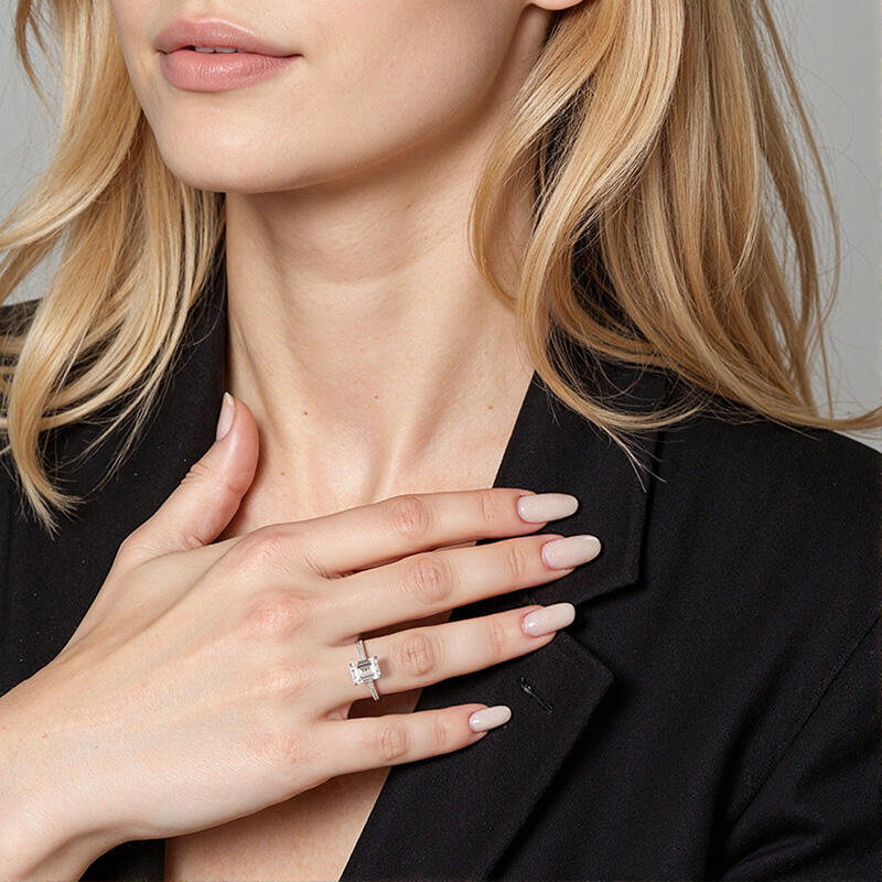 "Your Hand in Mine" 2ct Emerald Cut Side Stone Engagement Ring