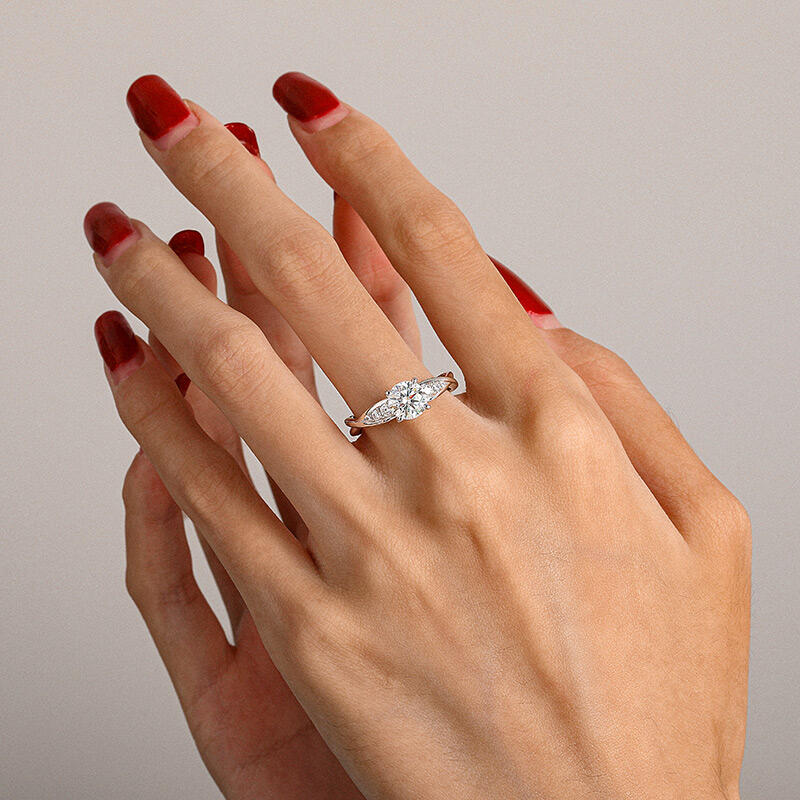 Jeulia Classic Twist Round Cut Engagement Ring with Side Stone