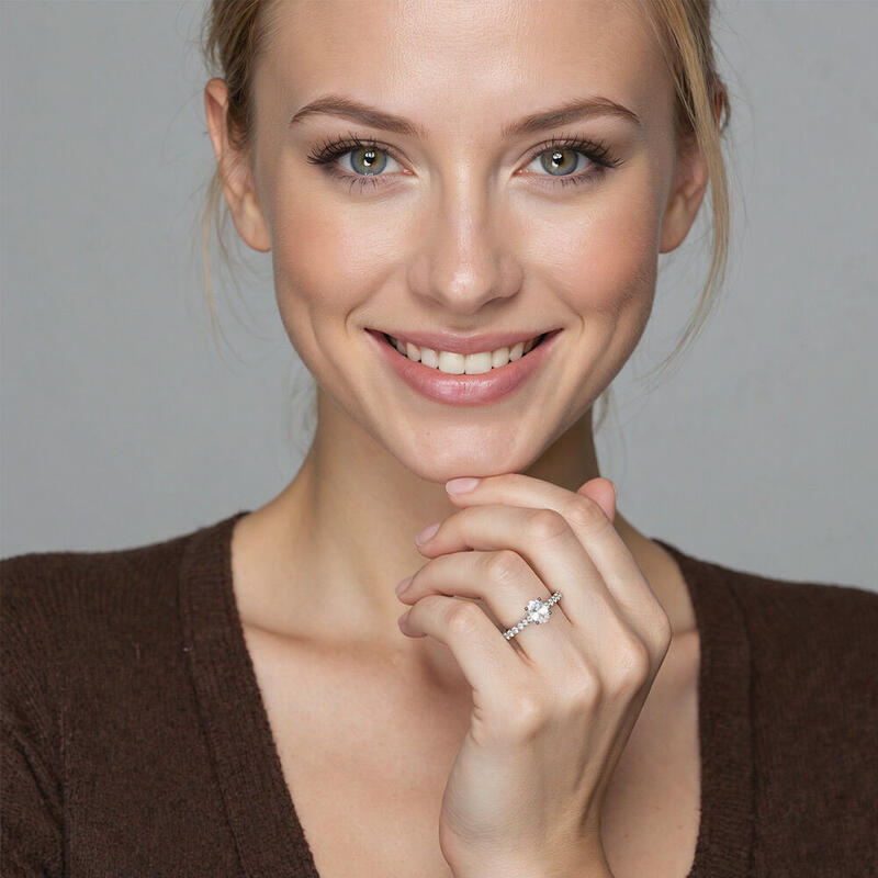 "Ever Since I Met You" Oval Cut Side Stone Engagement Ring