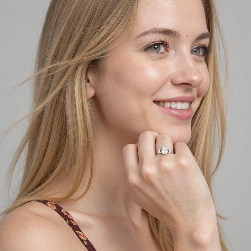 "Sun Glint" 2ct Pear Cut Side Stone Engagement Ring
