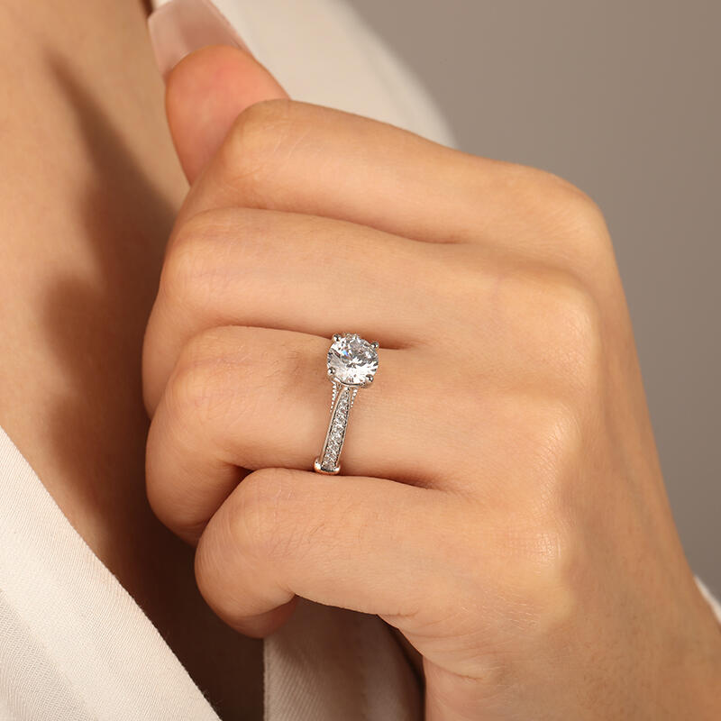 "The Breath From My Angel" Round Cut Side Stone Engagement Ring
