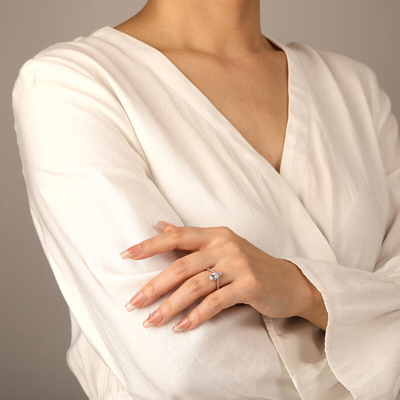 "A Drop Of Memories" Pear Cut Side Stone Engagement Ring