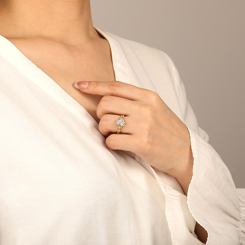 "Whisper Of Flowers" Pear Cut Side Stone Engagement Ring